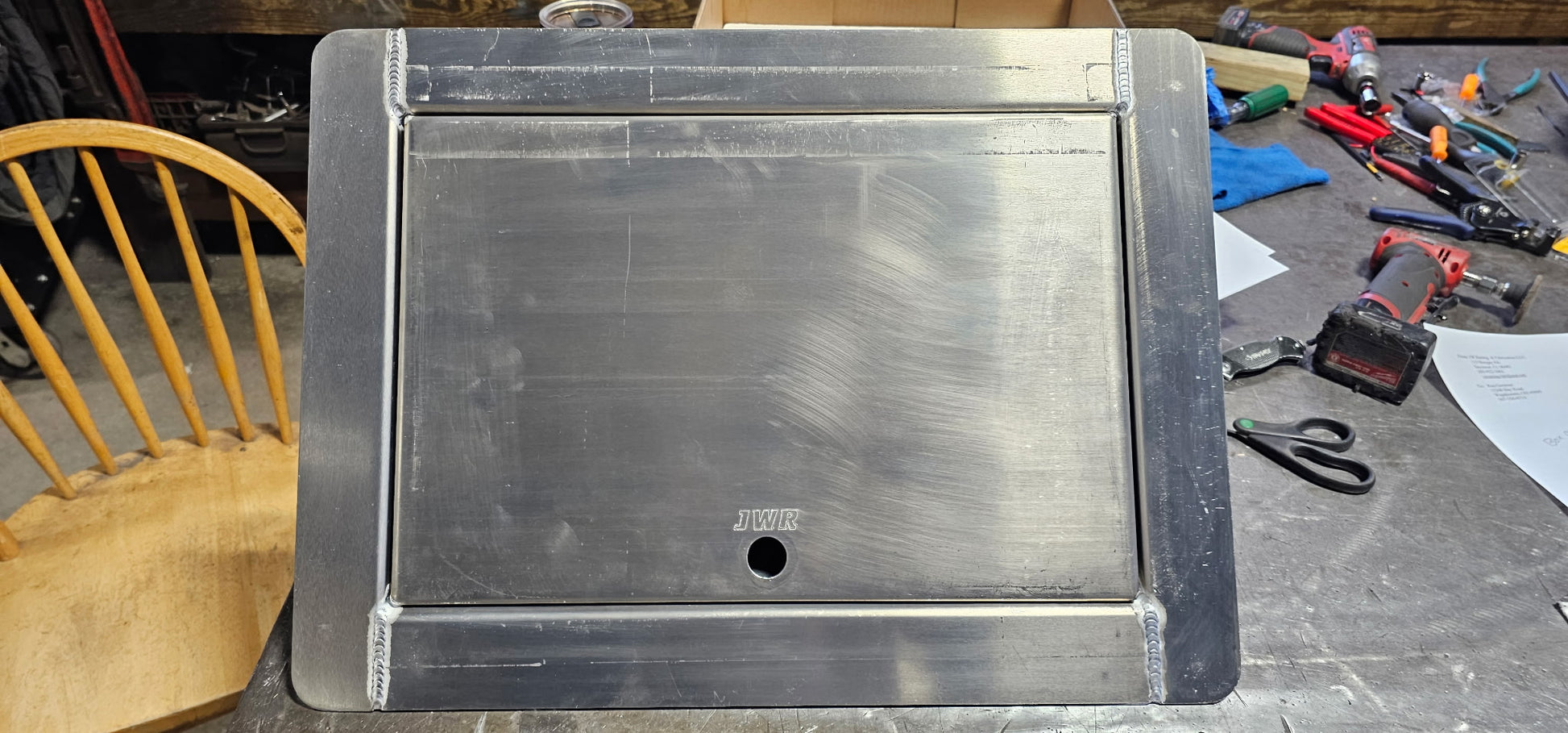 aluminum in floor winch box with the lid closed on a table top