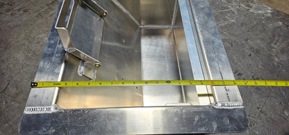 Aluminum winch box with a tape measure indicating that the overall length of the outside of the box is 18"  long.