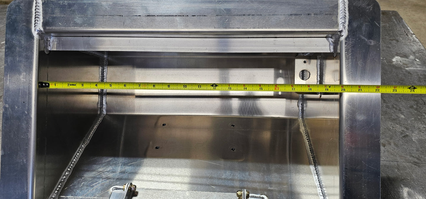 aluminum in floor winch box with the lid off showing a tape measure indicating the inside opening of the box is 20" wide