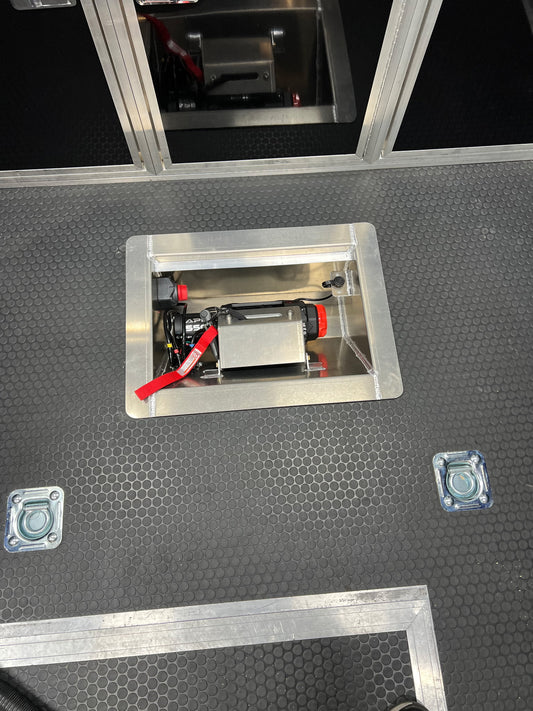 The customer photo of the in line winch box shows the box after it has been installed into the floor of the trailer and before it was been securely bolted into place. 